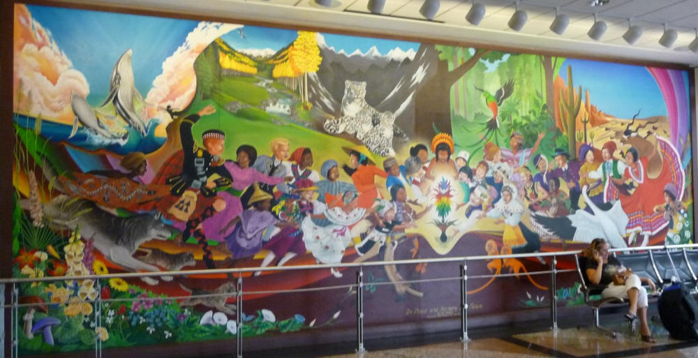 Children of the 4 original races worshipping a flower in a mural at the Denver New World Airport DIA