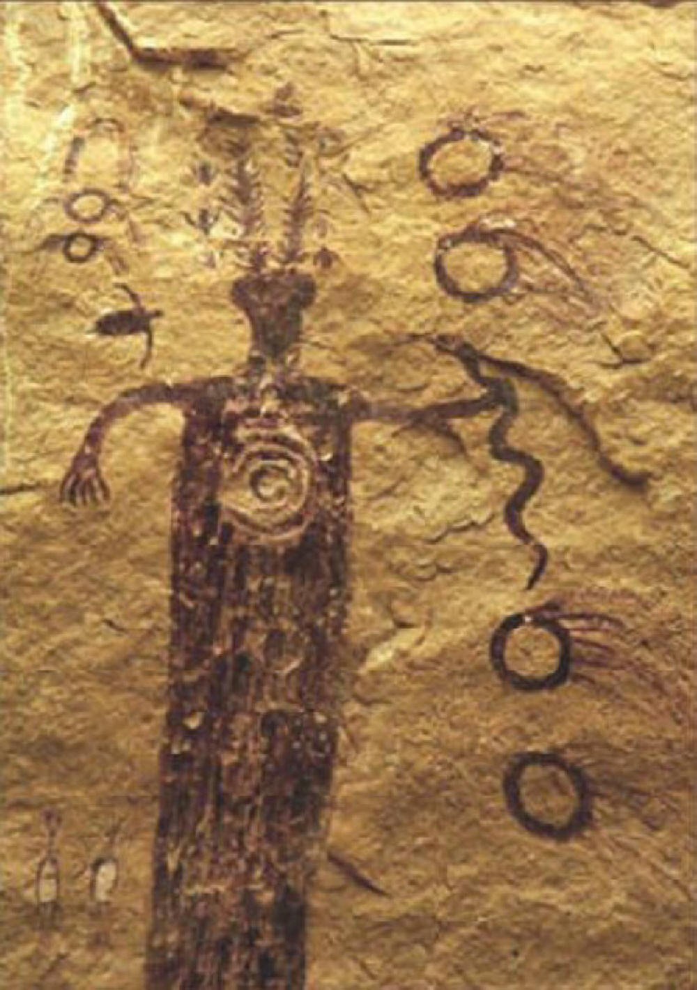 Spiral, devil, and serpent petroglyph